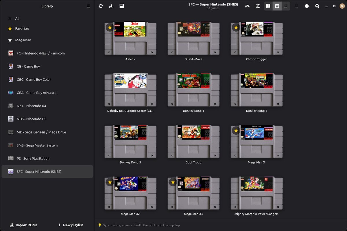 Biblioteca do OpenEmux mostrando jogos de SNES com suas capas